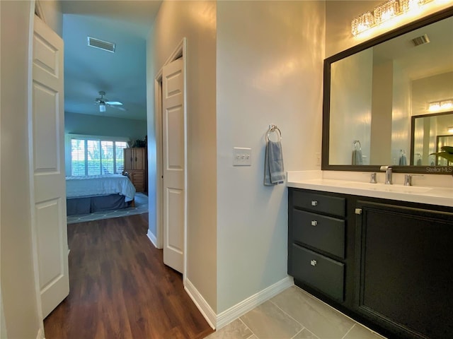 bathroom featuring vanity, ceiling fan, and hardwood / wood-style floors