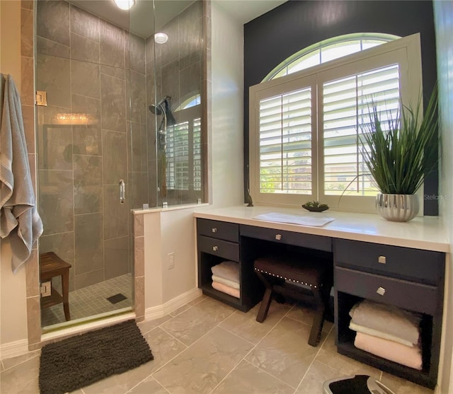 bathroom featuring vanity and an enclosed shower