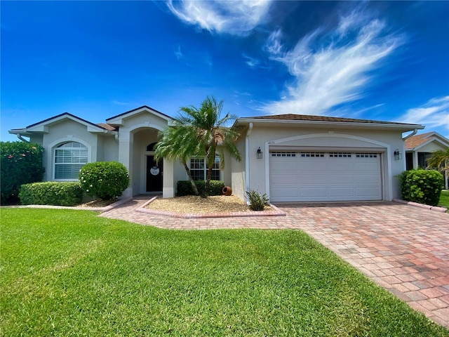 ranch-style house featuring a front yard and a garage