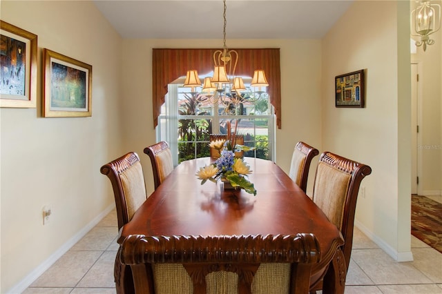 tiled dining area with a notable chandelier