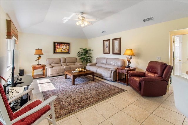 tiled living room with ceiling fan and vaulted ceiling