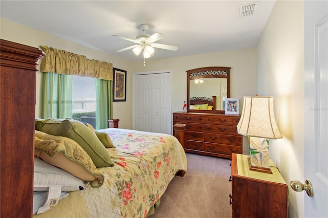 bedroom featuring a closet, carpet flooring, and ceiling fan