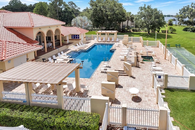 view of swimming pool with a patio and a lawn