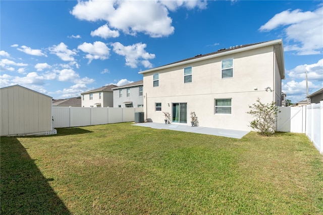 back of house with a patio, a lawn, a shed, and central air condition unit