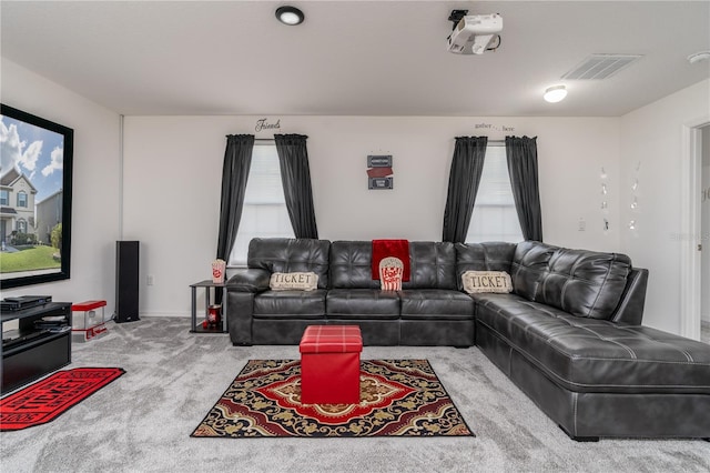 carpeted living room featuring plenty of natural light