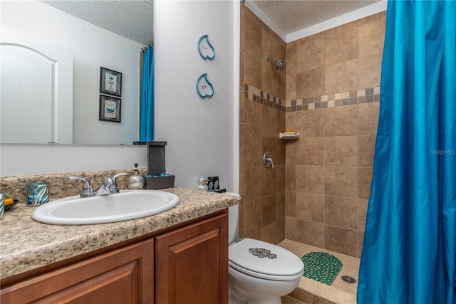 bathroom with toilet, a textured ceiling, a shower with curtain, and vanity