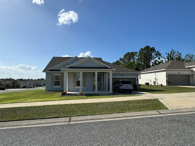 view of front of property featuring a front lawn and a garage