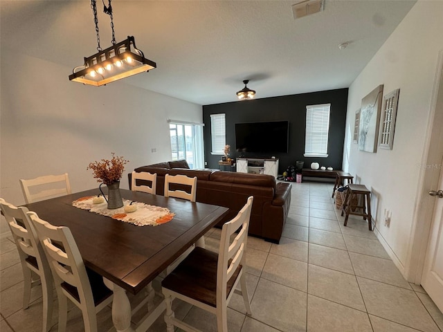 dining room with light tile patterned flooring