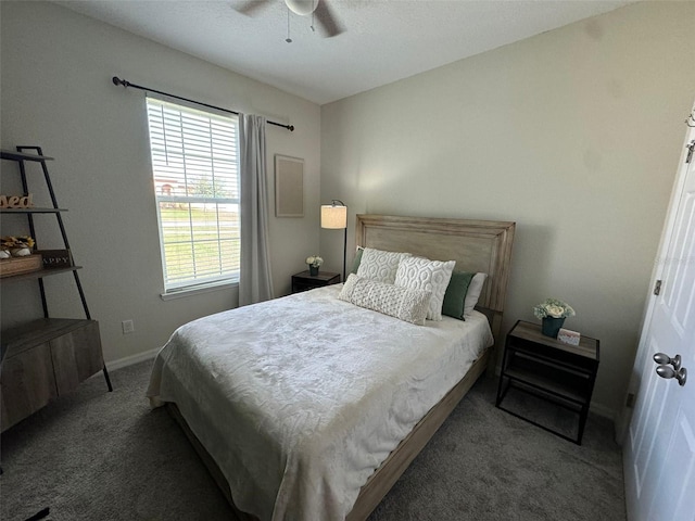 bedroom with dark carpet and ceiling fan