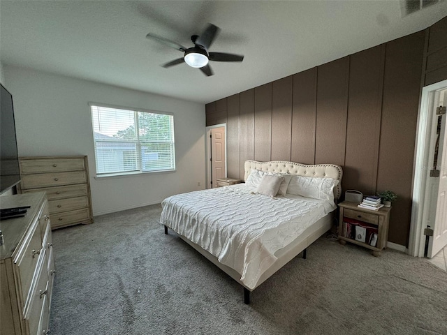 bedroom featuring ceiling fan and light carpet