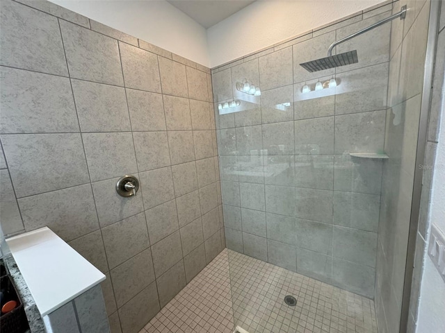 bathroom with tiled shower