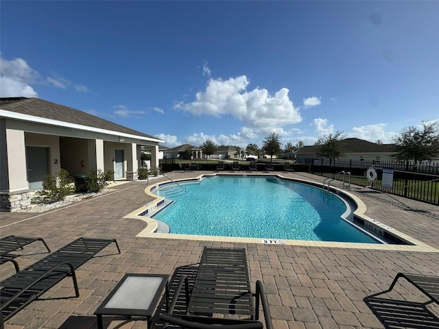 view of swimming pool featuring a patio