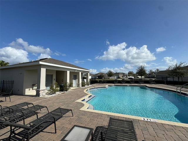 view of swimming pool featuring a patio