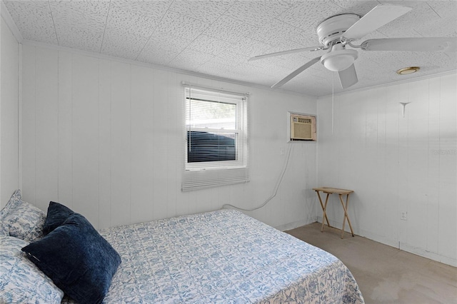 bedroom featuring ceiling fan, wood walls, and a wall mounted air conditioner