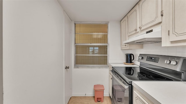 kitchen with tasteful backsplash and electric range