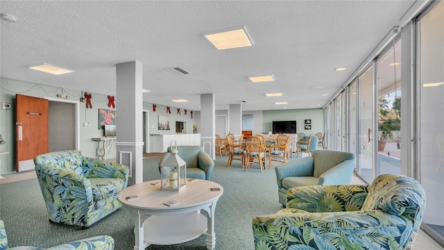 living room with carpet flooring and a textured ceiling