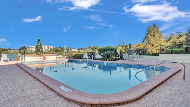 view of swimming pool featuring a patio area