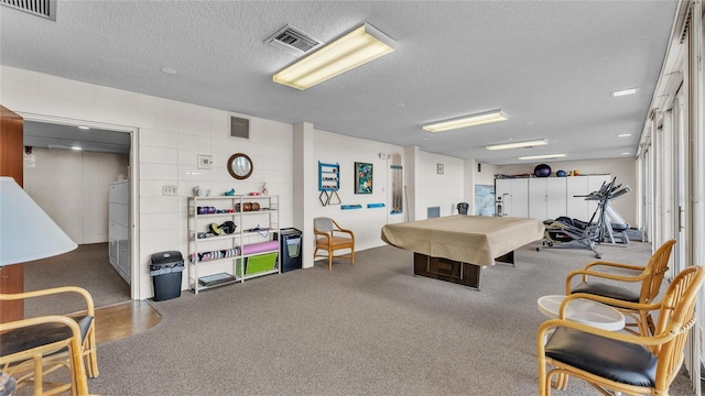 game room featuring carpet flooring, a textured ceiling, and pool table