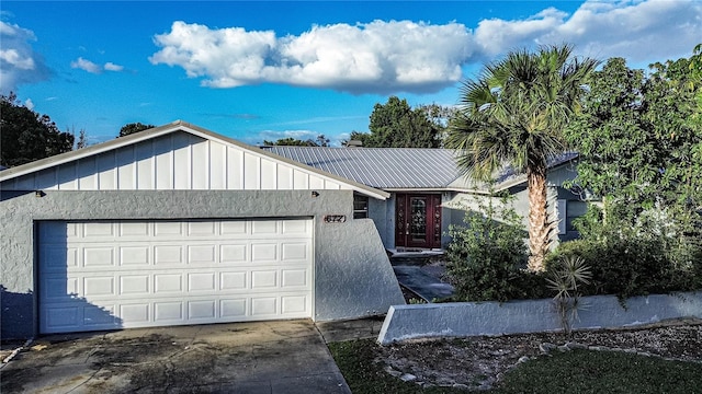 ranch-style home featuring a garage