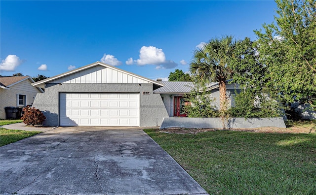 single story home with a front yard and a garage