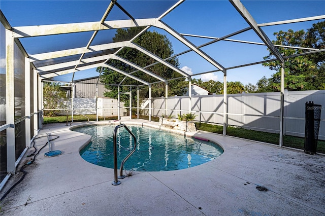 view of pool with a lanai and a patio area