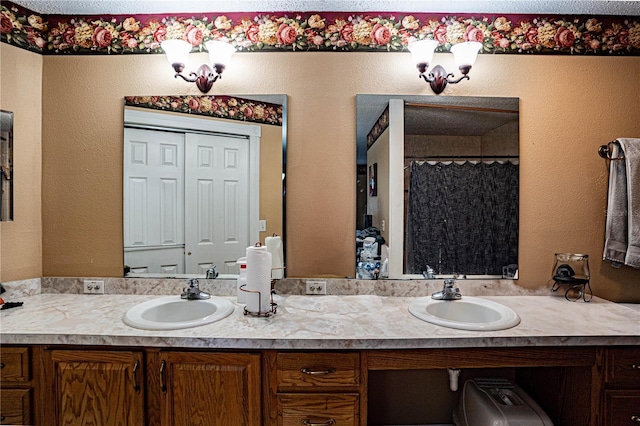 bathroom featuring vanity and curtained shower