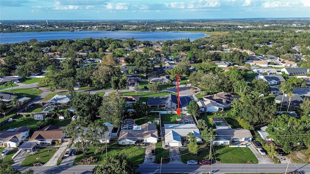 birds eye view of property with a water view