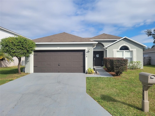 ranch-style home with a front yard and a garage