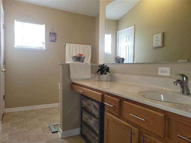 bathroom featuring vanity and vaulted ceiling