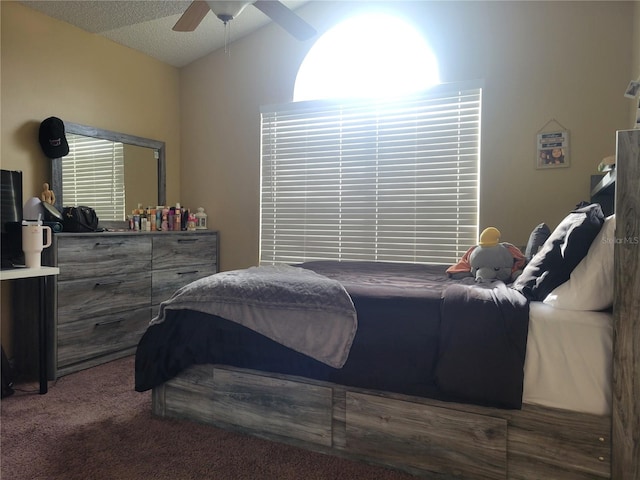 carpeted bedroom with vaulted ceiling and ceiling fan