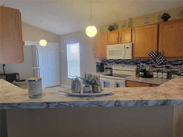 kitchen featuring decorative backsplash, decorative light fixtures, and white appliances