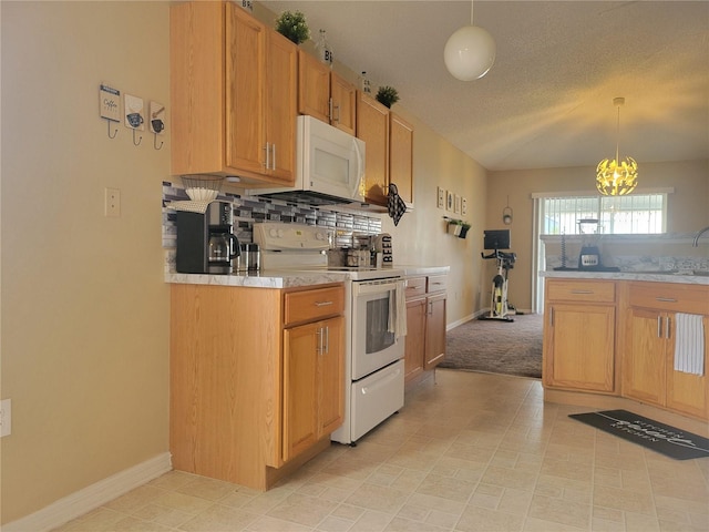 kitchen with white appliances, backsplash, a textured ceiling, hanging light fixtures, and a notable chandelier