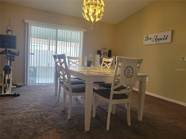 dining space with vaulted ceiling and carpet floors