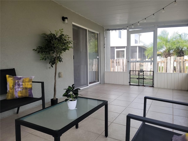 sunroom / solarium with track lighting