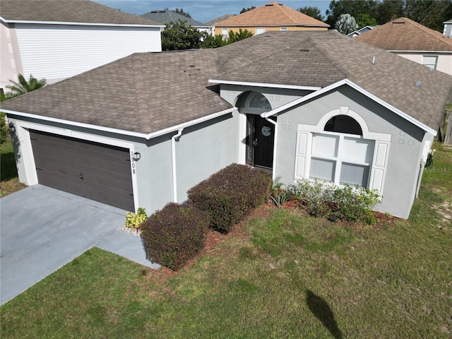 ranch-style house with a front lawn and a garage