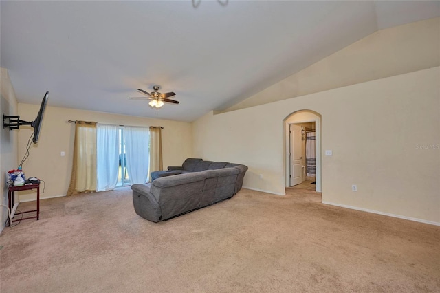 living room with vaulted ceiling, light carpet, and ceiling fan