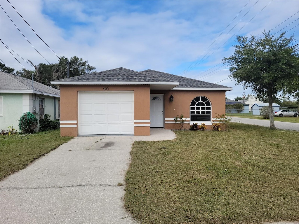 single story home with a garage and a front yard