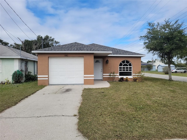 single story home with a garage and a front yard