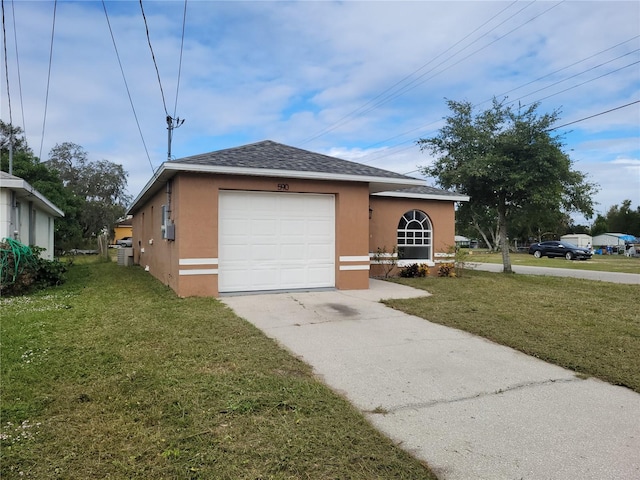 view of front of house with a garage and a front yard