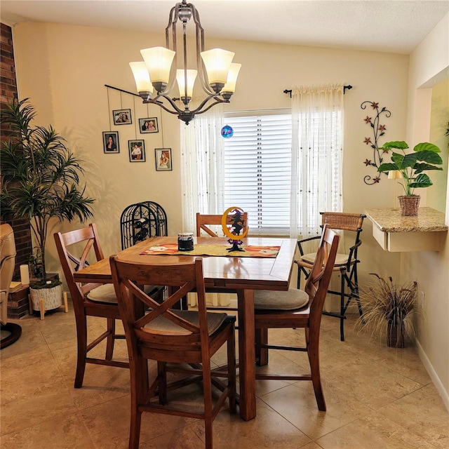 dining area with an inviting chandelier