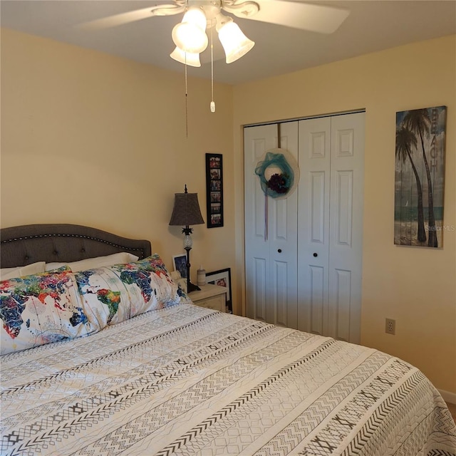 bedroom with ceiling fan and a closet