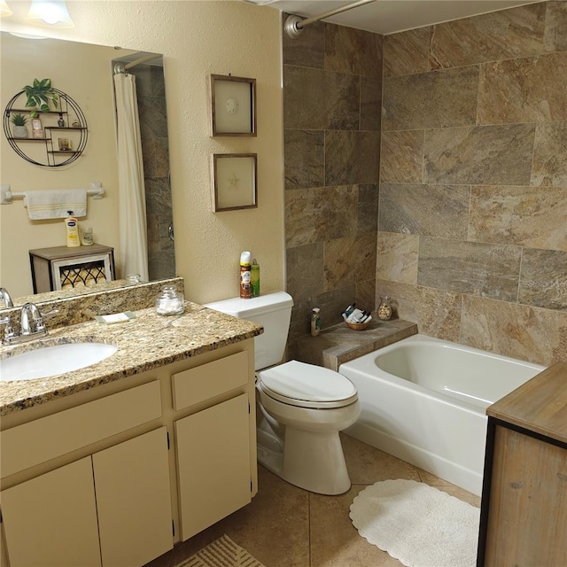 full bathroom featuring toilet, vanity, tile patterned flooring, and shower / bath combo with shower curtain