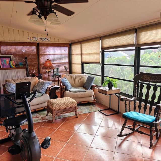 sunroom / solarium with ceiling fan and vaulted ceiling