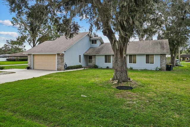 view of front of house with a garage and a front yard