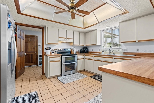 kitchen with white cabinetry, appliances with stainless steel finishes, a textured ceiling, and sink