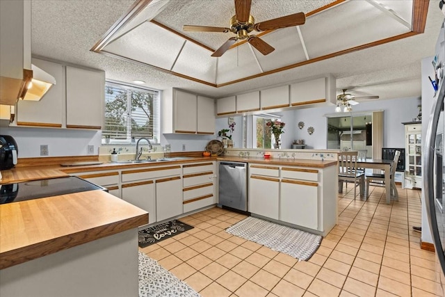 kitchen featuring white cabinetry, a textured ceiling, sink, dishwasher, and kitchen peninsula