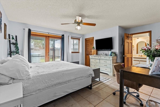 bedroom with access to outside, french doors, a textured ceiling, light tile patterned floors, and ceiling fan