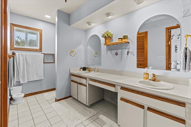 bathroom with vanity and tile patterned flooring