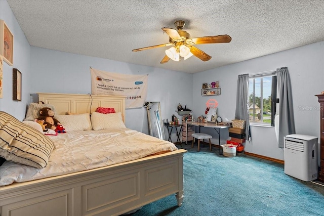 carpeted bedroom with a textured ceiling and ceiling fan