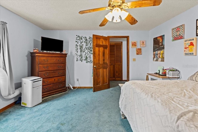 bedroom featuring a closet, a textured ceiling, carpet flooring, and ceiling fan